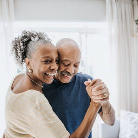 two people smiling and dancing